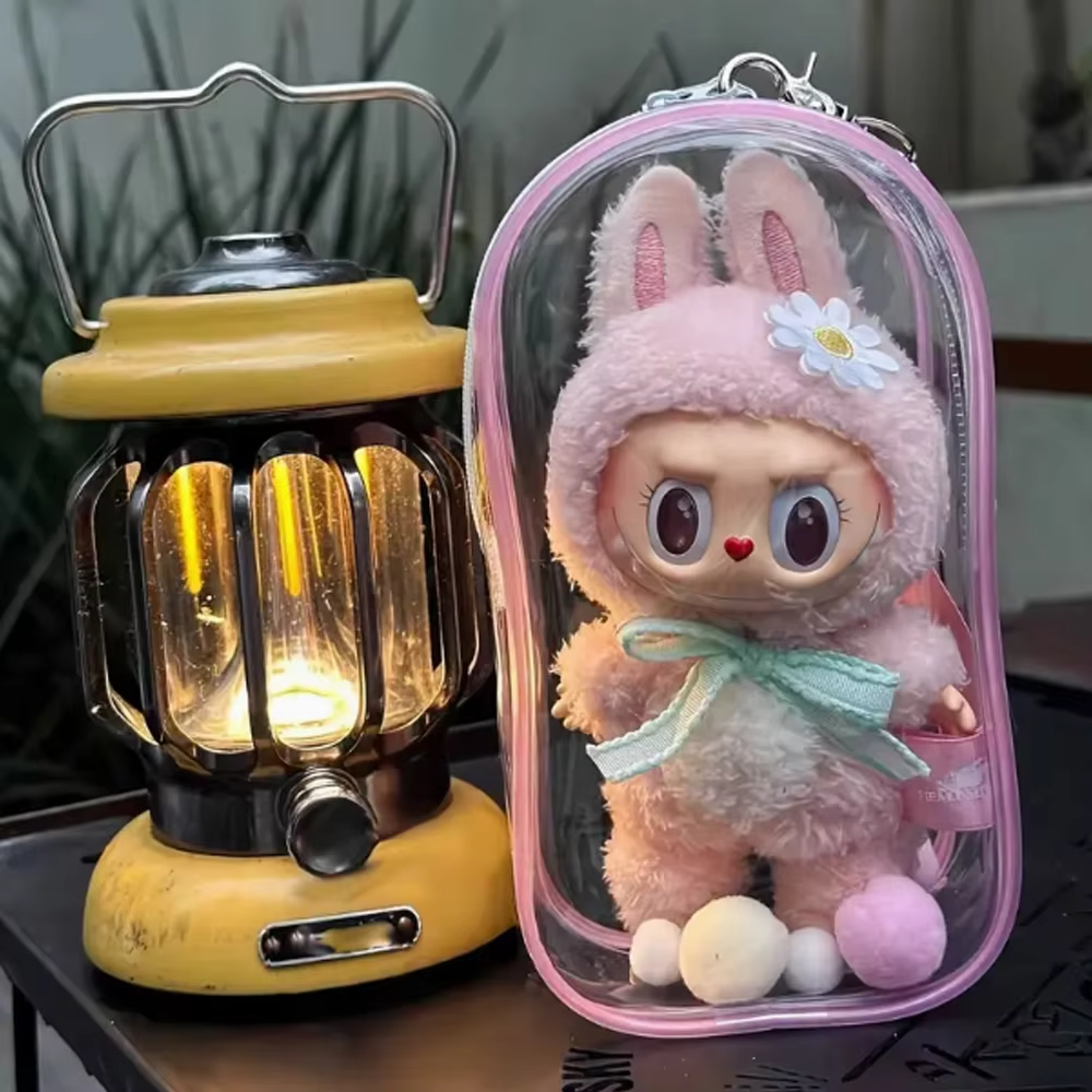 The PVC Storage Box with keychain and fur balls is perfect for organizing and storing your beloved 17cm Labubu figures and glue dolls