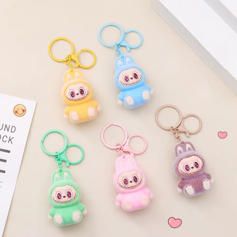 The Monsters-x-Labubu Macaron Pendant blind bag enchants like a hidden treasure