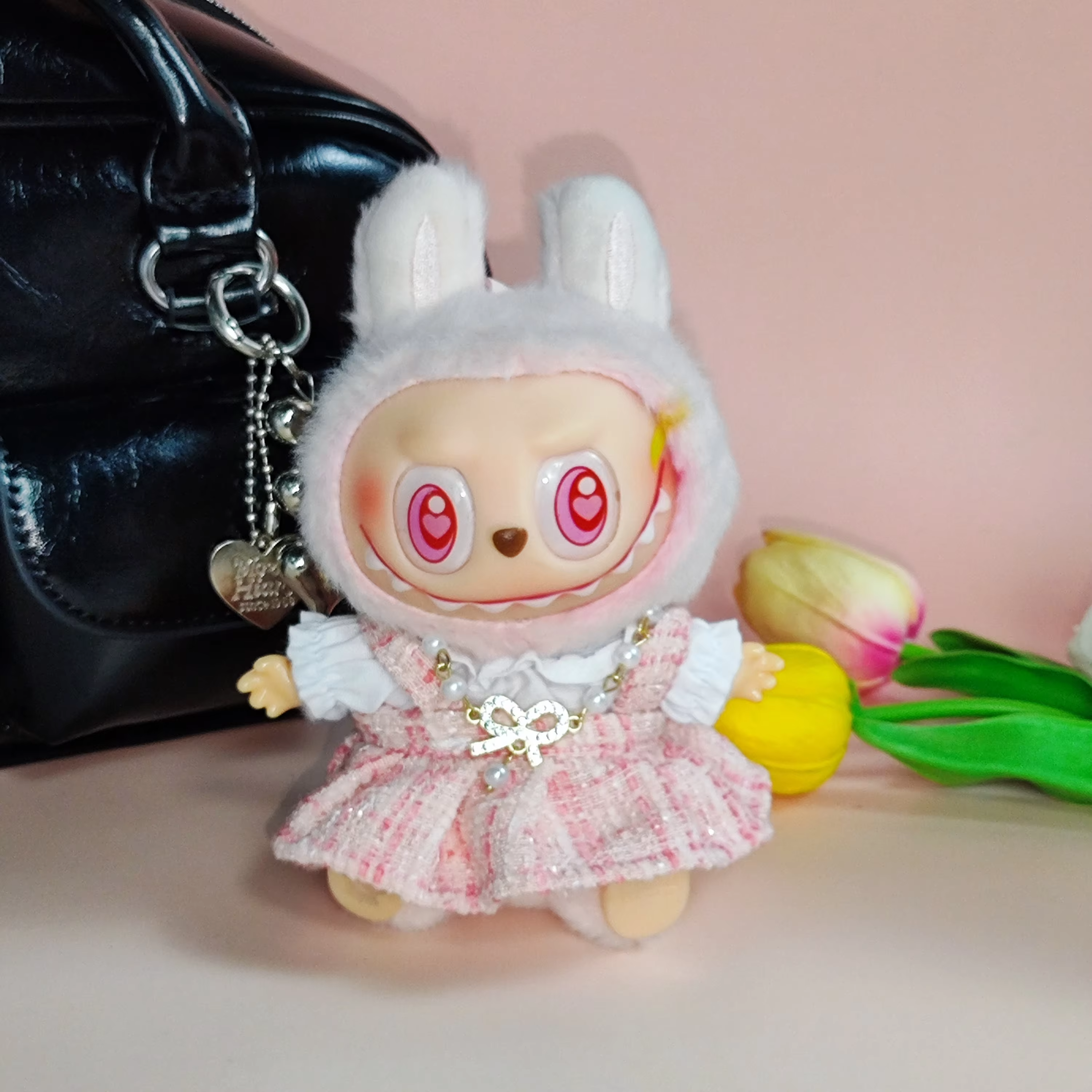 Shimmering with micro-glance gold trims, the Gen 1&2 Blind Box Labubu vinyl keychain packs runway punch into pocket-sized magic - Image 2