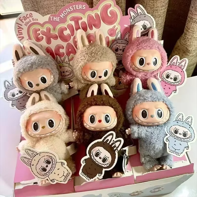 A Kawaii figure for a child's birthday, The Blind Box of The Monsters' Labubu Heartbeat Macaron PVC Figure Tabletop Ornament with Enamel Face