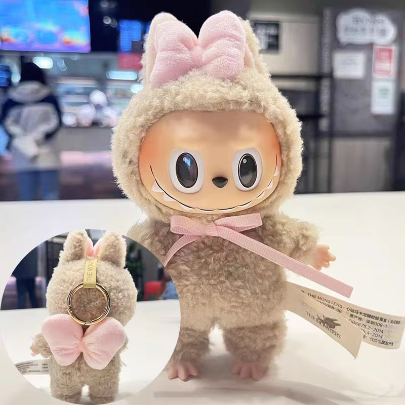 A sparkling new micro accessory for Labubu dolls—tiny bows meant to crown your fave outfits and matching hoodies—now completes the style story with pure sweetness. - Image 2
