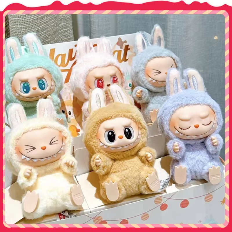 A surprise gift for kids is Labubu, the action figure keychain doll from the Macaron Biscuit Series. It comes with enchanting outfits and presents from the Monsters BlindBox Toy Vinyl Doll. You can accent soft doll clothes with keychains, my darling.